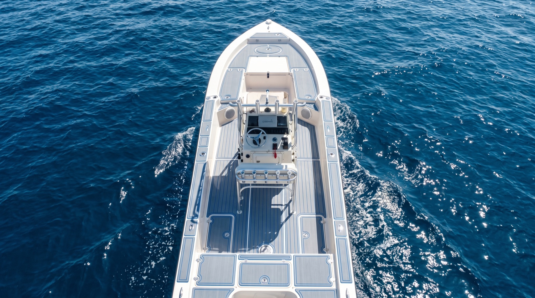 Aerial view of a center console with a full custom gray and blue EVA foam deck, underway