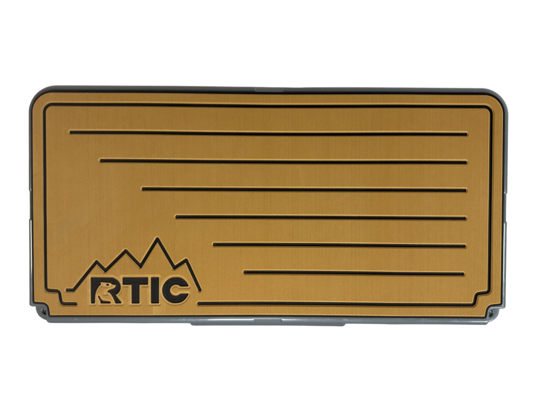 Cooler lid pad with the owner's logo routed through the teak top layer to the black accent beneath