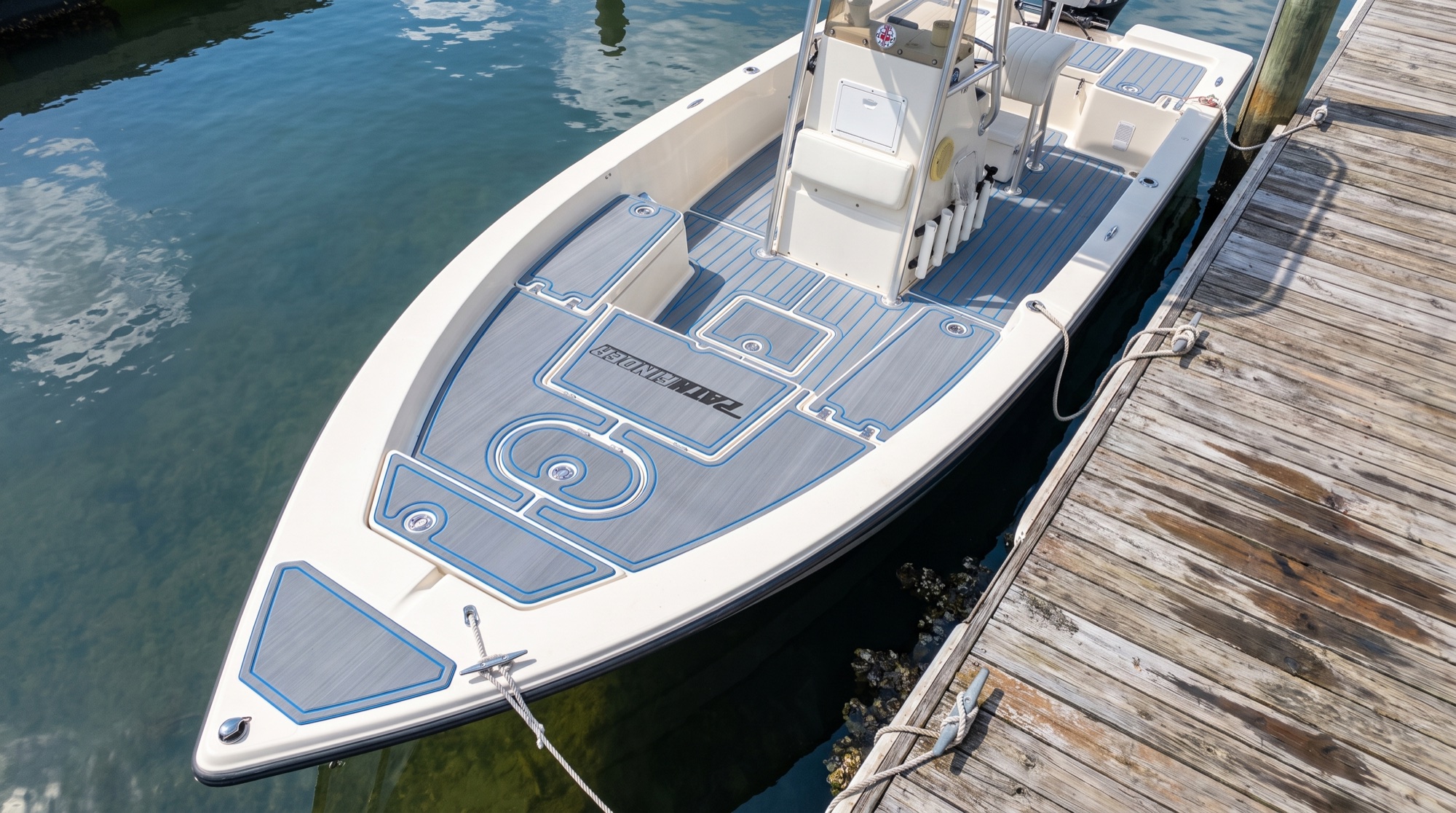 Center console at the dock with a full custom gray and blue EVA foam deck